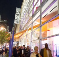 Exterior view of MoAD at night.