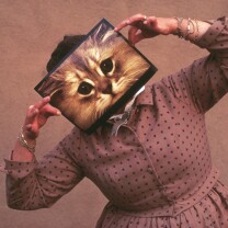 Ray Eames posing with a cat photograph Ray Eames posing with a cat photograph