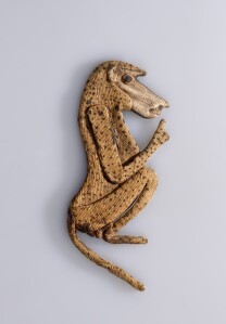 Baboon appliqué from an animal mummy. Possibly from Saqqara, Egypt Baboon appliqué from an animal mummy. Possibly from Saqqara, Egypt